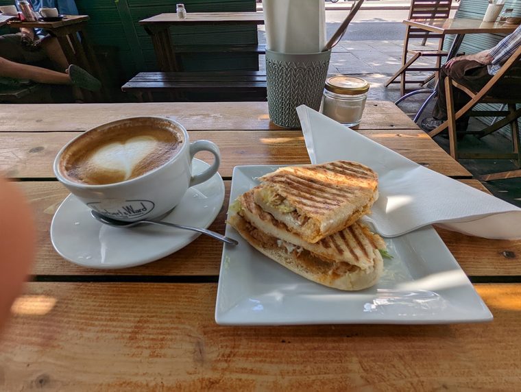 Toasted panini served with a latte